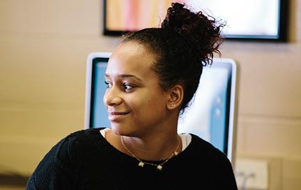 Student in front of a computer terminal